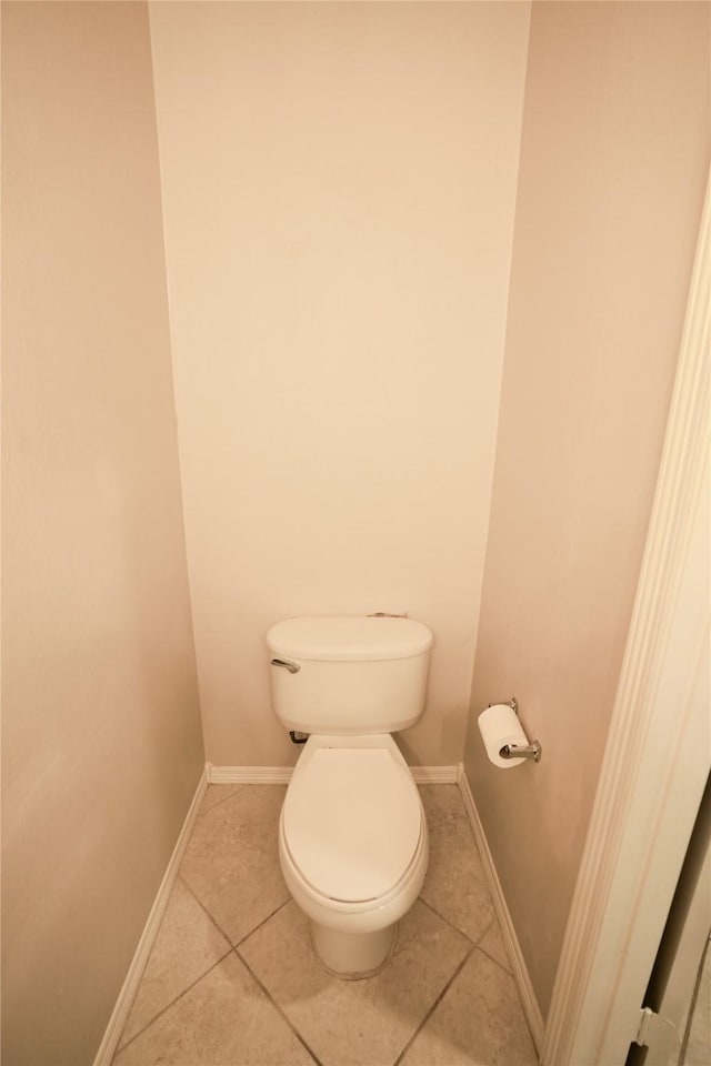 14106 Glen Canon Ln, Houston, TX 77069 - bathroom with tile patterned flooring, toilet, and baseboards