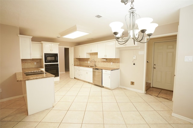 14106 Glen Canon Ln, Houston, TX 77069 - kitchen with black appliances, tasteful backsplash, light tile patterned floors, and a chandelier
