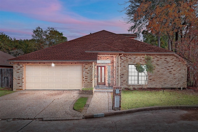 14106 Glen Canon Ln, Houston, TX 77069 - view of front of property featuring driveway, an attached garage, roof with shingles, brick siding, and a front yard