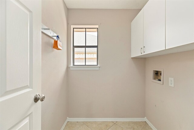 14106 Glen Canon Ln, Houston, TX 77069 - washroom featuring cabinet space, washer hookup, baseboards, and light tile patterned floors