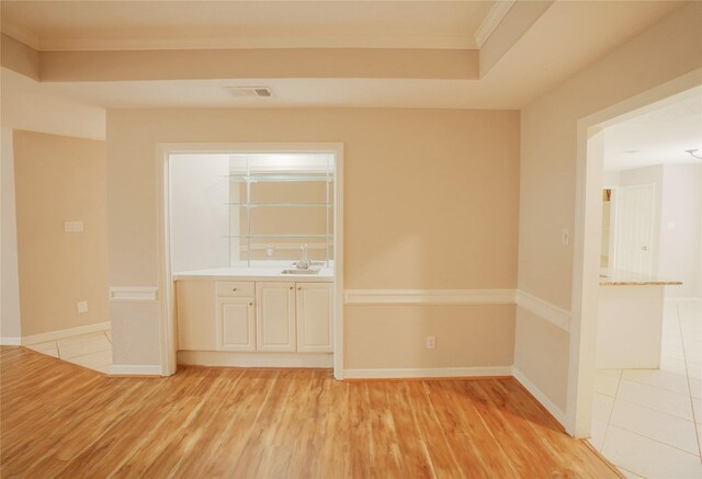 14106 Glen Canon Ln, Houston, TX 77069 - empty room with a sink, ornamental molding, light wood-style floors, and baseboards