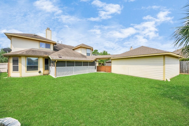 20902 Montana Bend Ln, Cypress, TX 77433 - back of house with a sunroom and a chimney