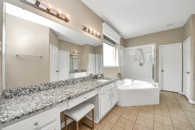 20902 Montana Bend Ln, Cypress, TX 77433 - full bath featuring a garden tub, a stall shower, tile patterned flooring, and vanity