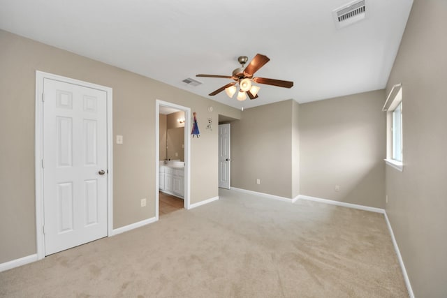 20902 Montana Bend Ln, Cypress, TX 77433 - unfurnished bedroom featuring light colored carpet, baseboards, ensuite bath, and a ceiling fan