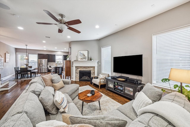 1115 E 27th St, Houston, TX 77009 - living area featuring a ceiling fan, baseboards, dark wood-style floors, and recessed lighting