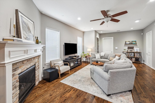 1115 E 27th St, Houston, TX 77009 - living room with a fireplace, a ceiling fan, dark wood-type flooring, and recessed lighting