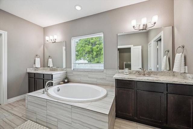 1115 E 27th St, Houston, TX 77009 - full bath featuring a chandelier, a garden tub, and vanity