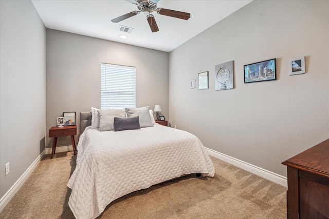 1115 E 27th St, Houston, TX 77009 - bedroom with light carpet, baseboards, and a ceiling fan