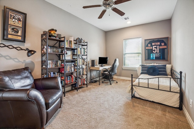 1115 E 27th St, Houston, TX 77009 - carpeted home office featuring a ceiling fan and baseboards