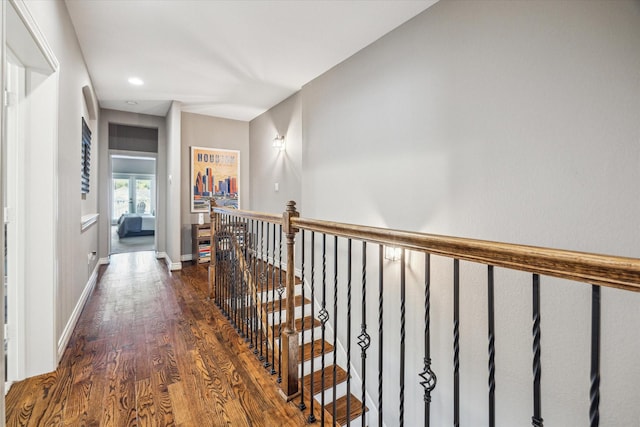 1115 E 27th St, Houston, TX 77009 - corridor with an upstairs landing, dark wood finished floors, baseboards, and recessed lighting