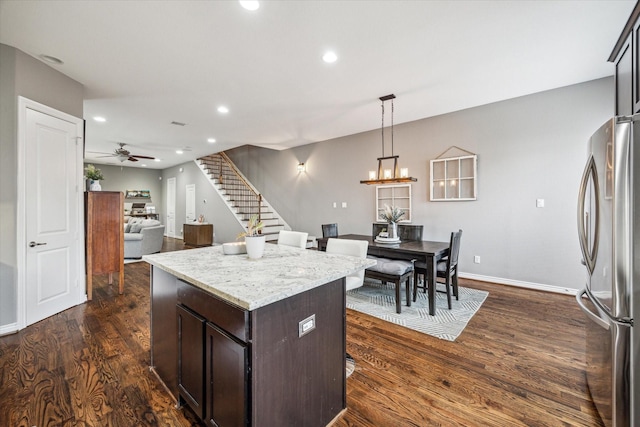 1115 E 27th St, Houston, TX 77009 - kitchen with freestanding refrigerator, a ceiling fan, dark wood-style floors, recessed lighting, and a kitchen island