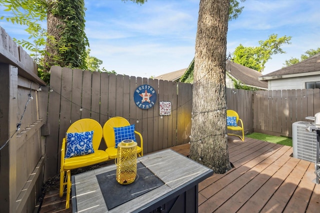 1115 E 27th St, Houston, TX 77009 - wooden deck featuring a fenced backyard and central air condition unit