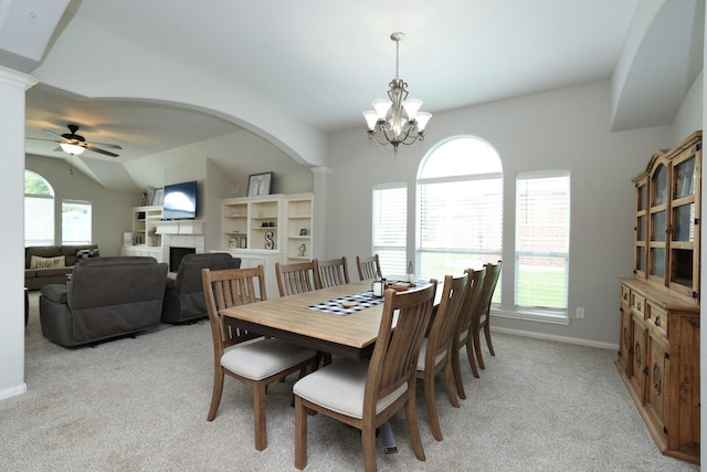 301 Redwood St, Prairie View, TX 77445 - dining room with light carpet, plenty of natural light, a fireplace, and ornate columns
