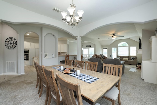 301 Redwood St, Prairie View, TX 77445 - dining space featuring arched walkways, light colored carpet, vaulted ceiling, ceiling fan, and a chandelier