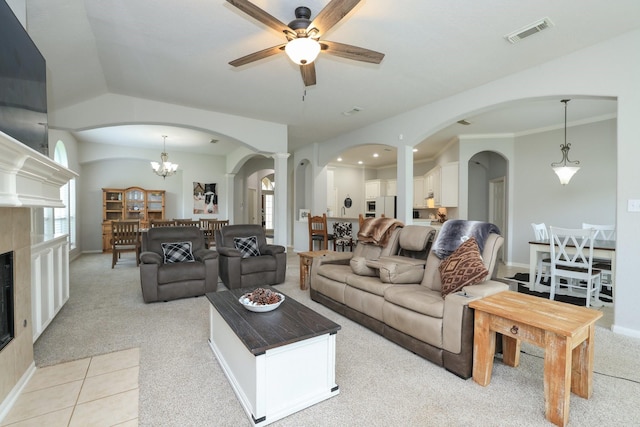301 Redwood St, Prairie View, TX 77445 - living room with arched walkways, a ceiling fan, and light carpet