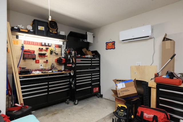 301 Redwood St, Prairie View, TX 77445 - garage featuring a workshop area and a wall unit AC