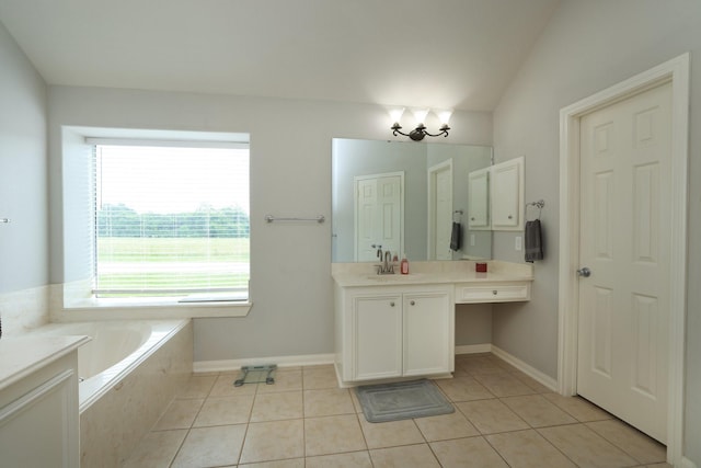 301 Redwood St, Prairie View, TX 77445 - full bathroom with vanity, a garden tub, tile patterned flooring, baseboards, and a chandelier