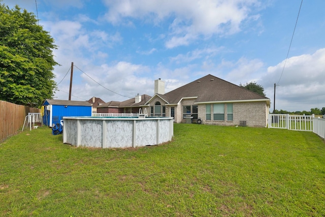 301 Redwood St, Prairie View, TX 77445 - back of house with brick siding and a chimney