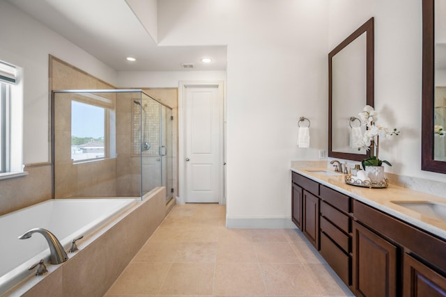 1217 E 28th St, Houston, TX 77009 - full bath with double vanity, a garden tub, a stall shower, tile patterned floors, and recessed lighting