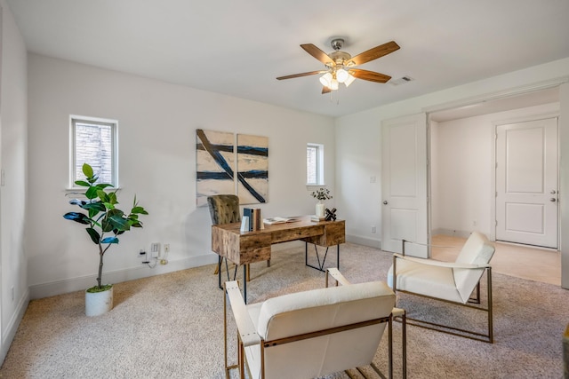 1217 E 28th St, Houston, TX 77009 - office area featuring light carpet, ceiling fan, and baseboards