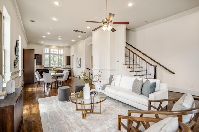 1217 E 28th St, Houston, TX 77009 - living room with ornamental molding, dark wood finished floors, recessed lighting, ceiling fan, and stairway