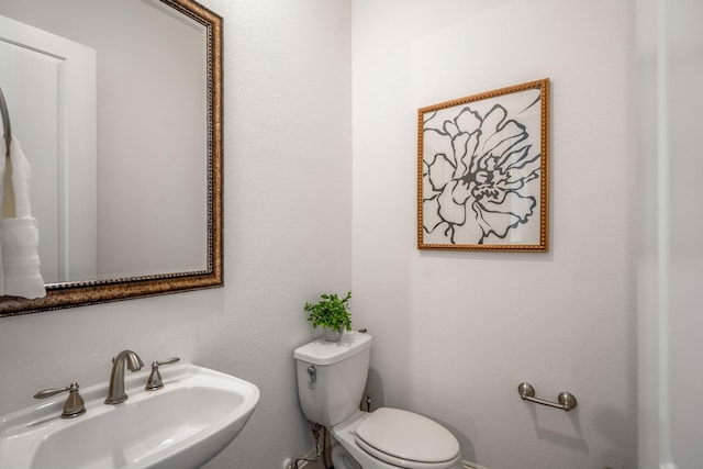 1217 E 28th St, Houston, TX 77009 - half bath featuring a sink and toilet