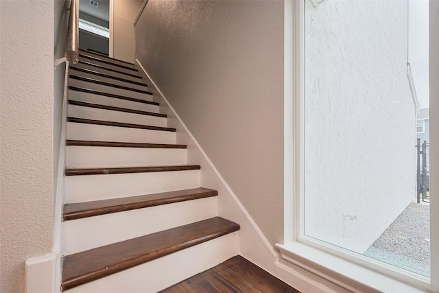 10260 Field Stone, Houston, TX 77041 - staircase featuring a textured wall and wood finished floors