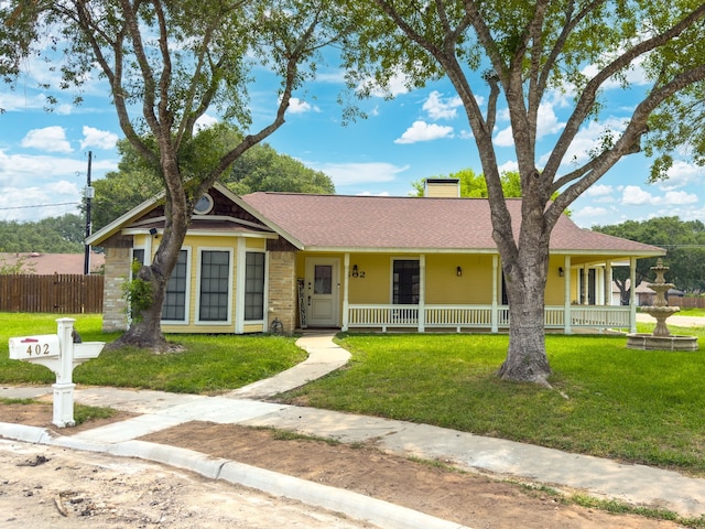 402 Teakwood Dr, Victoria, TX 77901 - view of front of property featuring a chimney, covered porch, and a shingled roof