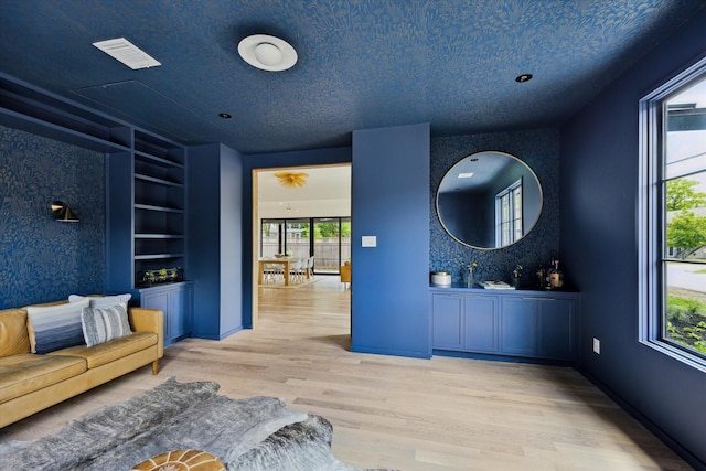 703 E 9th St, Houston, TX 77007 - unfurnished living room with light wood-style floors