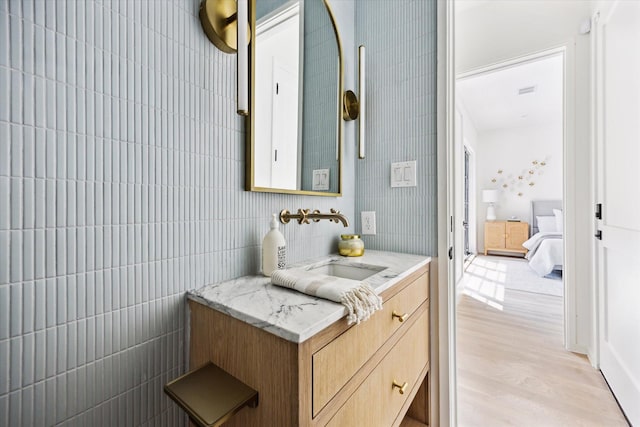 703 E 9th St, Houston, TX 77007 - bathroom featuring vanity and wood finished floors