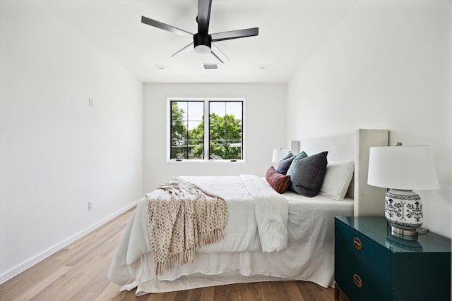 703 E 9th St, Houston, TX 77007 - bedroom featuring light wood-style flooring, baseboards, and ceiling fan