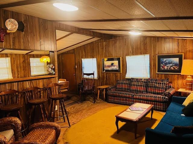 11200 Leisure Rd, Brenham, TX 77833 - living room featuring wood walls and wood finished floors