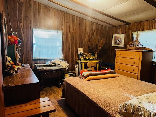 11200 Leisure Rd, Brenham, TX 77833 - bedroom with wooden walls