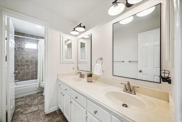 1318 N Gabriel River Cir, Sugar Land, TX 77478 - bathroom with double vanity, toilet, shower / bathtub combination with curtain, and baseboards