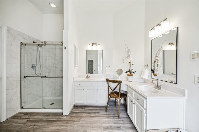1318 N Gabriel River Cir, Sugar Land, TX 77478 - bathroom featuring a marble finish shower, vanity, and wood finished floors