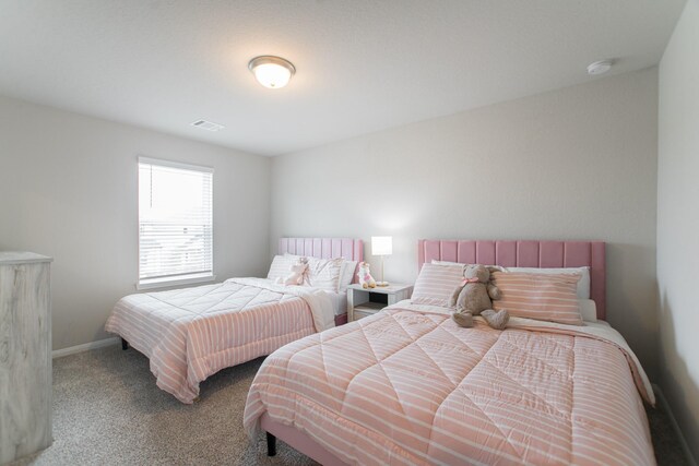 17542 Rosette Grass Dr, Conroe, TX 77385 - bedroom featuring carpet flooring and baseboards