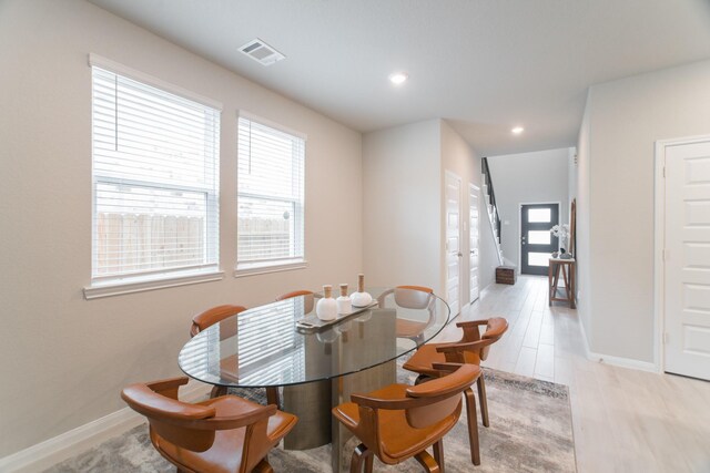 17542 Rosette Grass Dr, Conroe, TX 77385 - dining space with baseboards, recessed lighting, and stairs