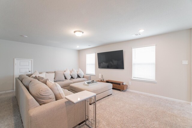 17542 Rosette Grass Dr, Conroe, TX 77385 - carpeted living area with baseboards