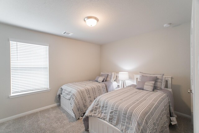 17542 Rosette Grass Dr, Conroe, TX 77385 - bedroom with baseboards and light carpet