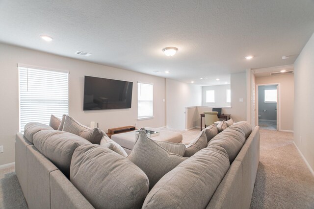 17542 Rosette Grass Dr, Conroe, TX 77385 - living area with light carpet, recessed lighting, and baseboards