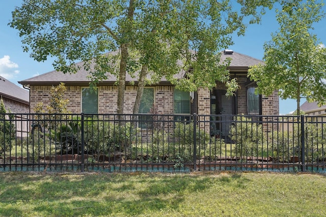 10029 Red Beadtree Pl, Conroe, TX 77385 - view of front of home featuring brick siding and roof with shingles