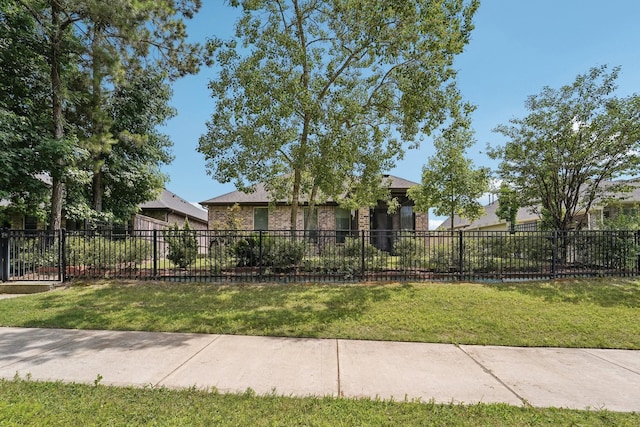 10029 Red Beadtree Pl, Conroe, TX 77385 - obstructed view of property with brick siding