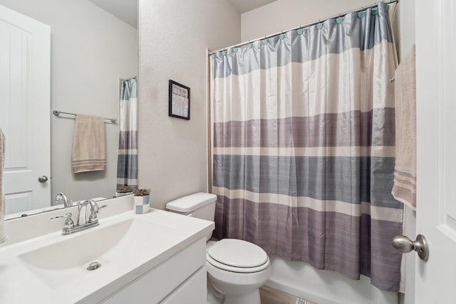 10029 Red Beadtree Pl, Conroe, TX 77385 - full bath featuring toilet, a textured wall, vanity, and shower / bath combination with curtain