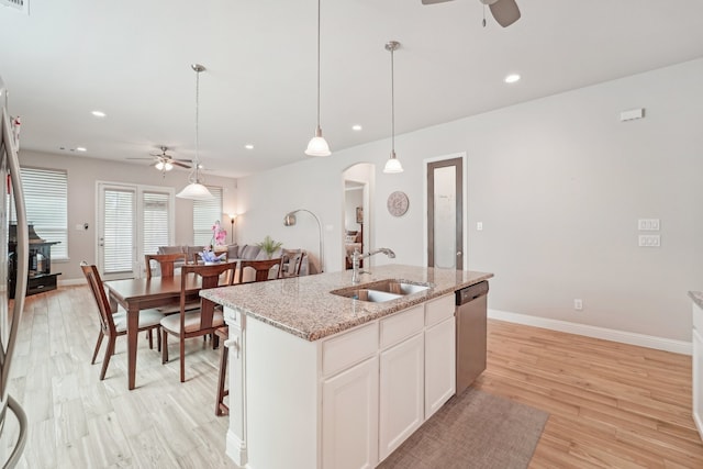 10029 Red Beadtree Pl, Conroe, TX 77385 - kitchen with a ceiling fan, a sink, stainless steel dishwasher, arched walkways, and recessed lighting