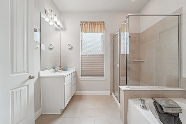 10029 Red Beadtree Pl, Conroe, TX 77385 - full bath featuring vanity, a shower stall, a bath, baseboards, and tile patterned flooring