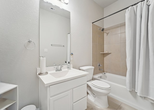 10029 Red Beadtree Pl, Conroe, TX 77385 - full bath with toilet, vanity, shower / bathtub combination with curtain, and tile patterned flooring