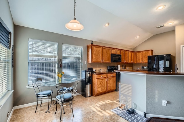2604 Hewn Rock Way, Pearland, TX 77584 - kitchen featuring refrigerator, electric range oven, plenty of natural light, black microwave, and lofted ceiling