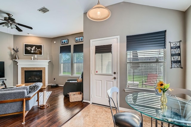 2604 Hewn Rock Way, Pearland, TX 77584 - living area featuring a ceiling fan, baseboards, a tiled fireplace, and wood finished floors