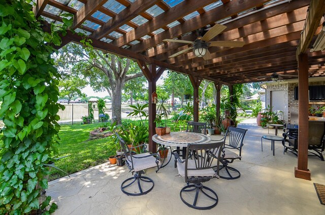 24511 Pelican Hill Dr, Katy, TX 77494 - view of patio with ceiling fan, a pergola, and outdoor dining space