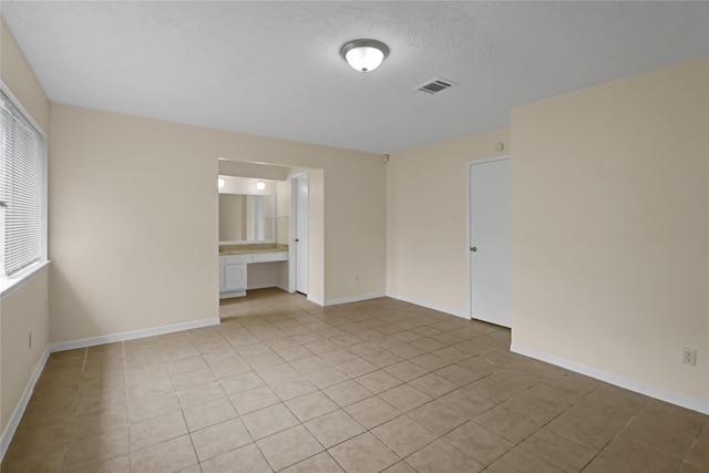 10211 Golden Meadow Dr, Houston, TX 77064 - empty room featuring light tile patterned flooring and baseboards